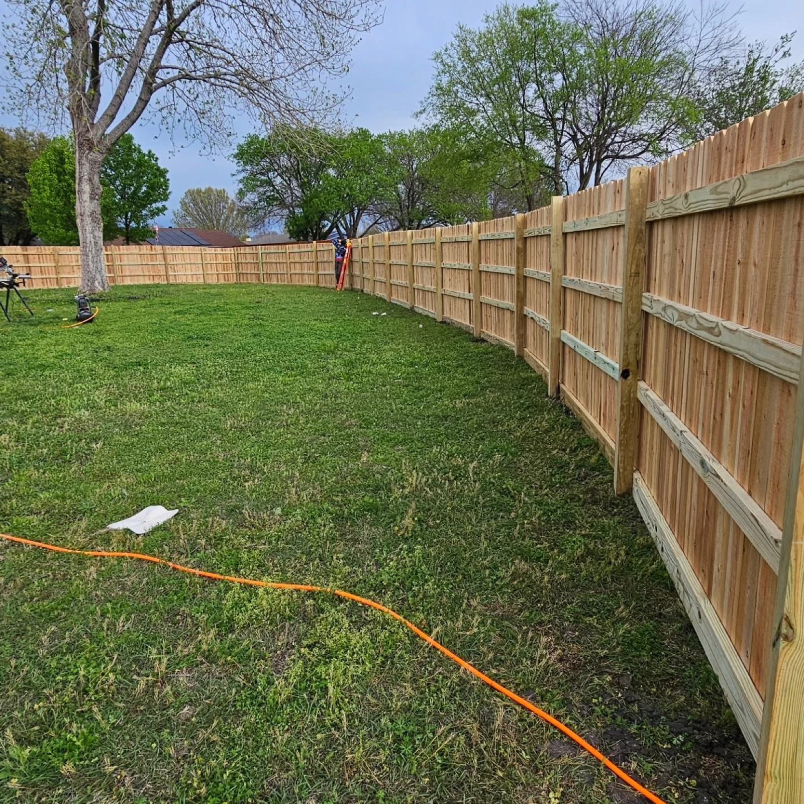 Completed wood privacy fence installation